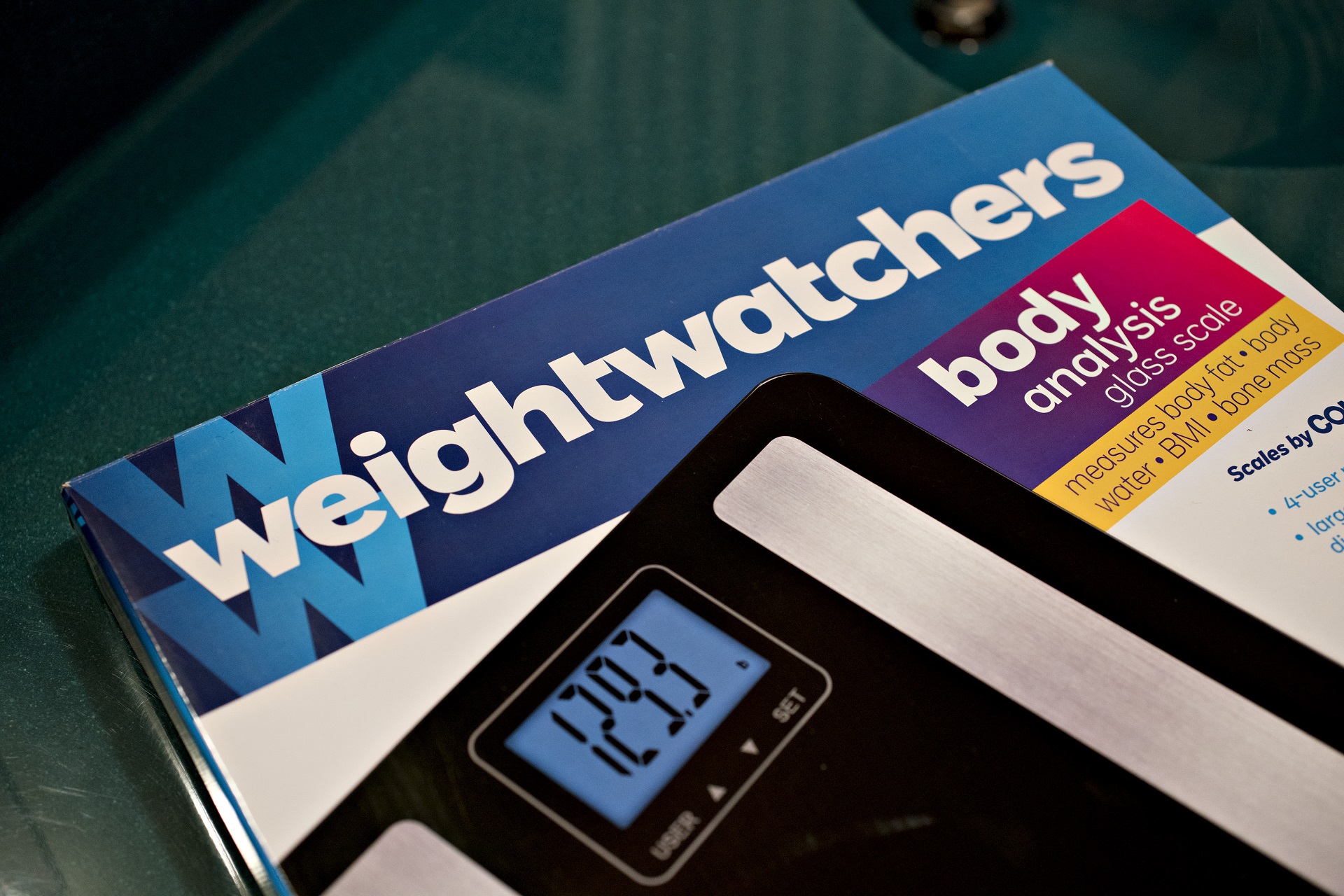 A bathroom scale branded by Weight Watchers.